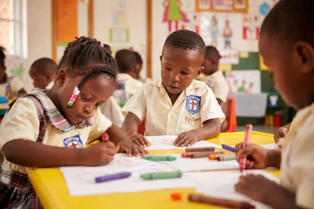 Children in classroom at New Hope Primary School